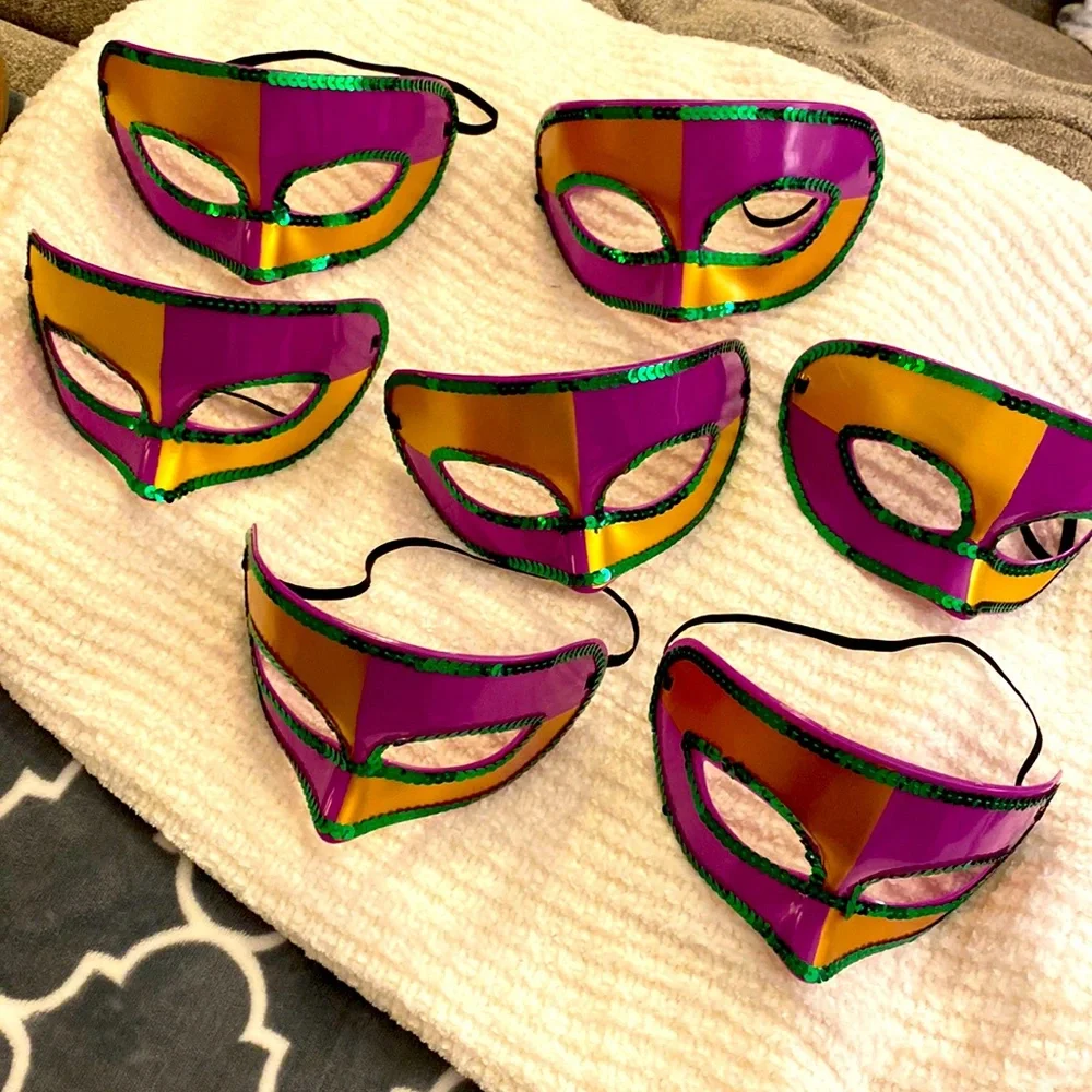 Set of 7 Mardi Gras Masks! Hard plastic purple masks. Very hearty and will last!